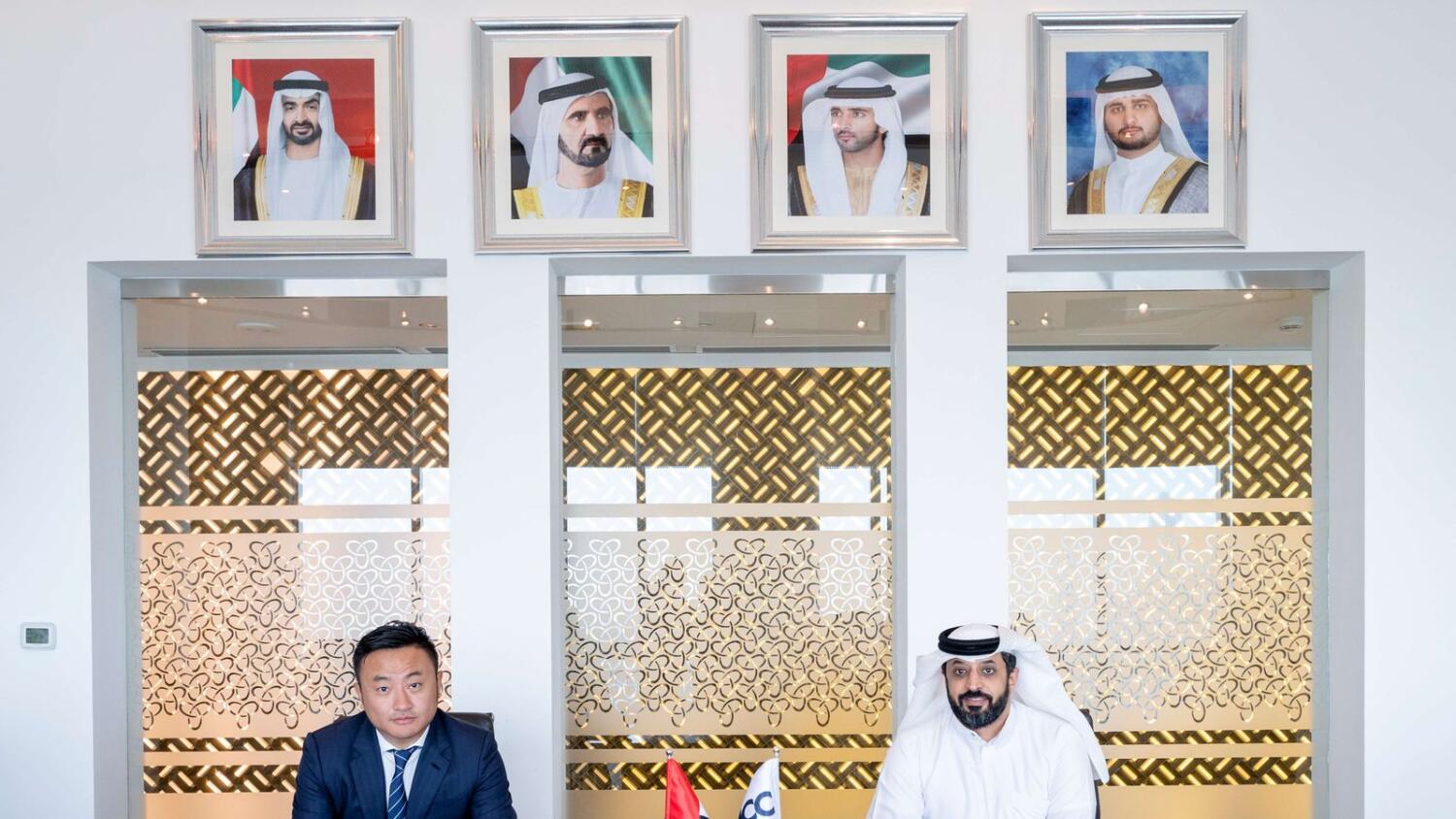 Ahmed Bin Sulayem, executive chairman and chief executive of DMCC, signs the agreement with Ben Zhou, Co-Founder and CEO of Bybit.— WAM